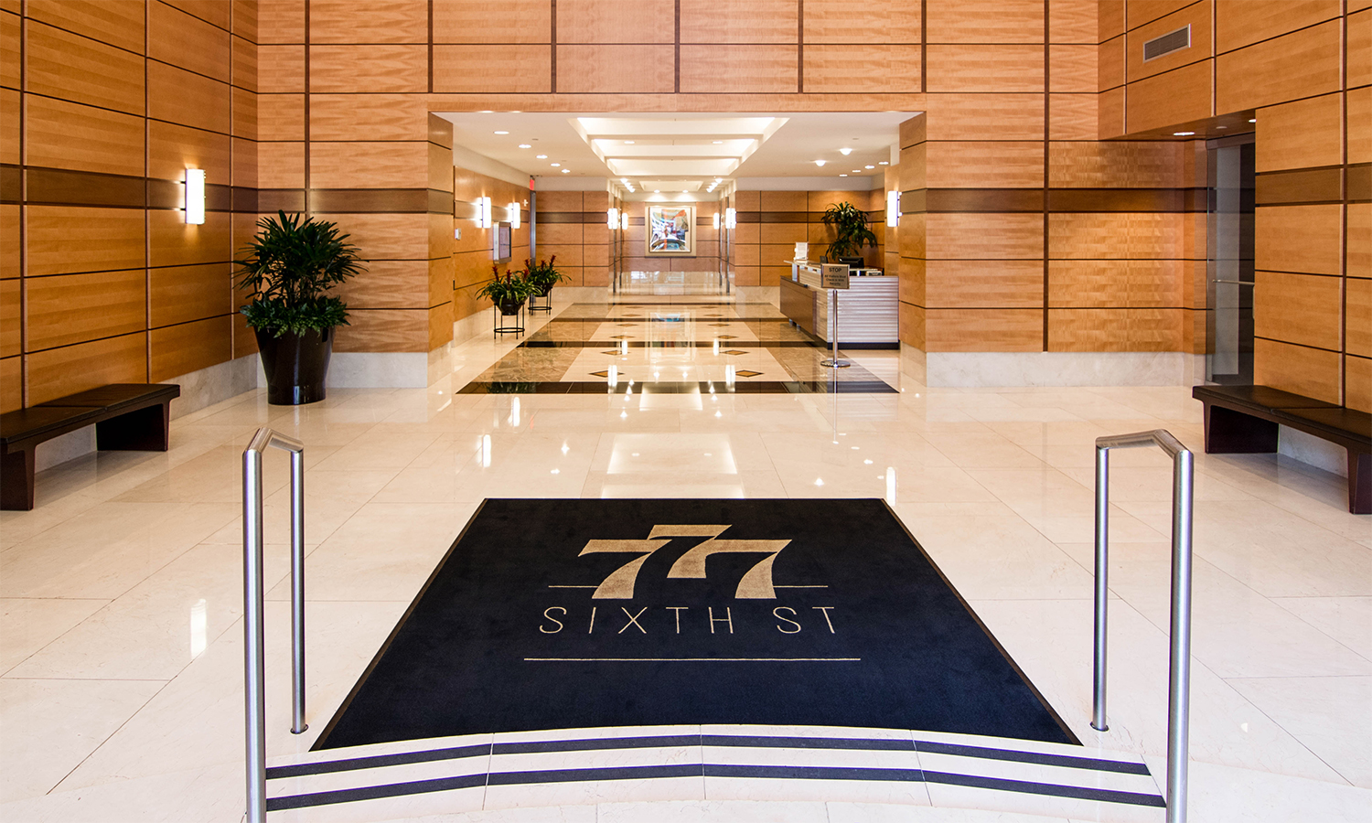 777 Sixth logo on lobby rug